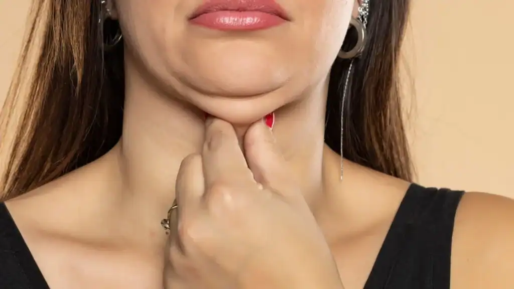 An image of a woman with double chin, sad, worried : Non Surgical Double Chin Removal Treatment in Renfrew, UK